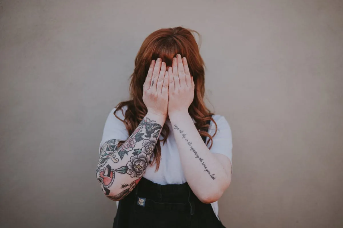 Woman tattoos covering face
